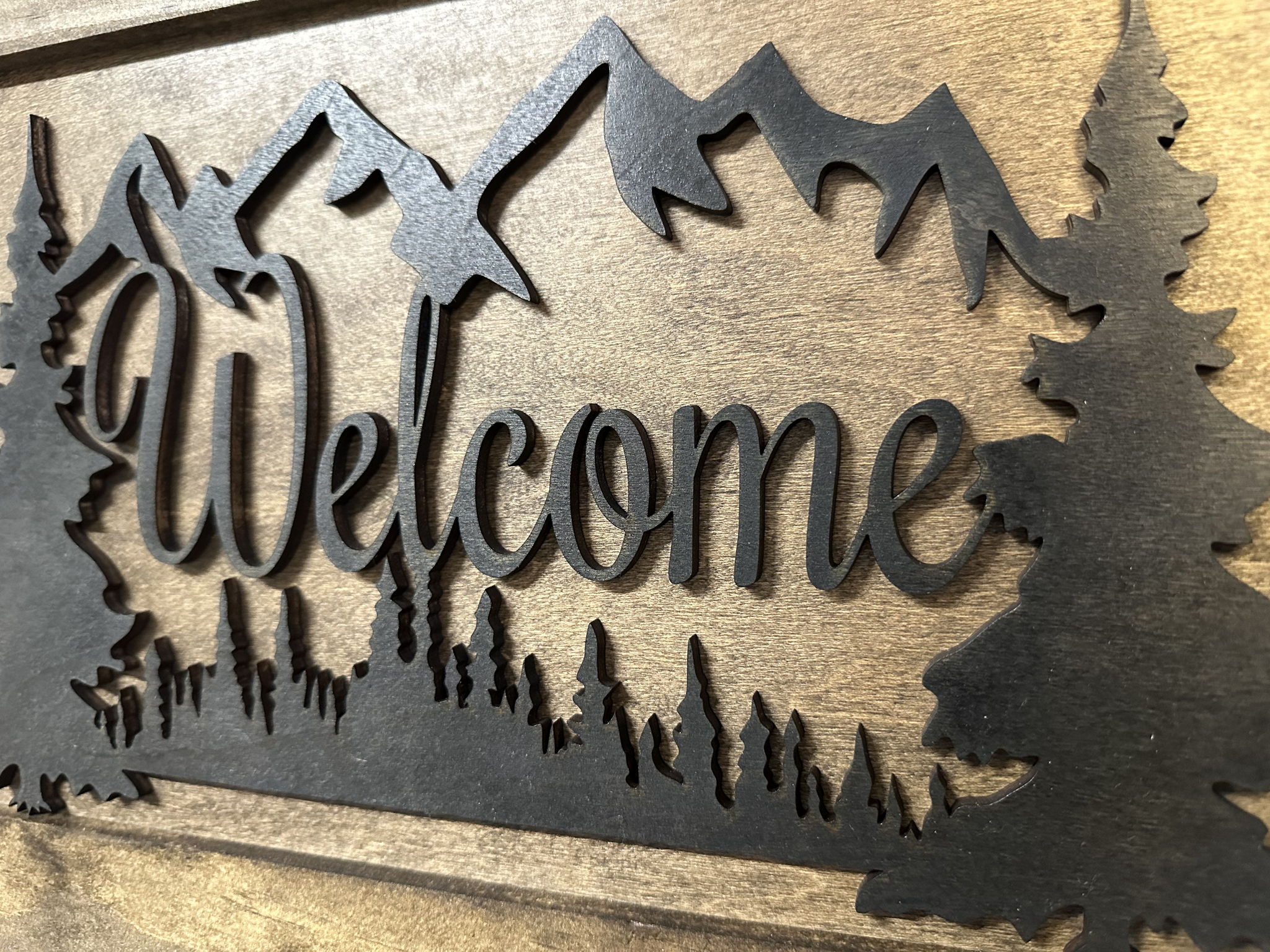 Rustic Mountain Welcome Concealed Wall-Mounted Gun Cabinet with close view