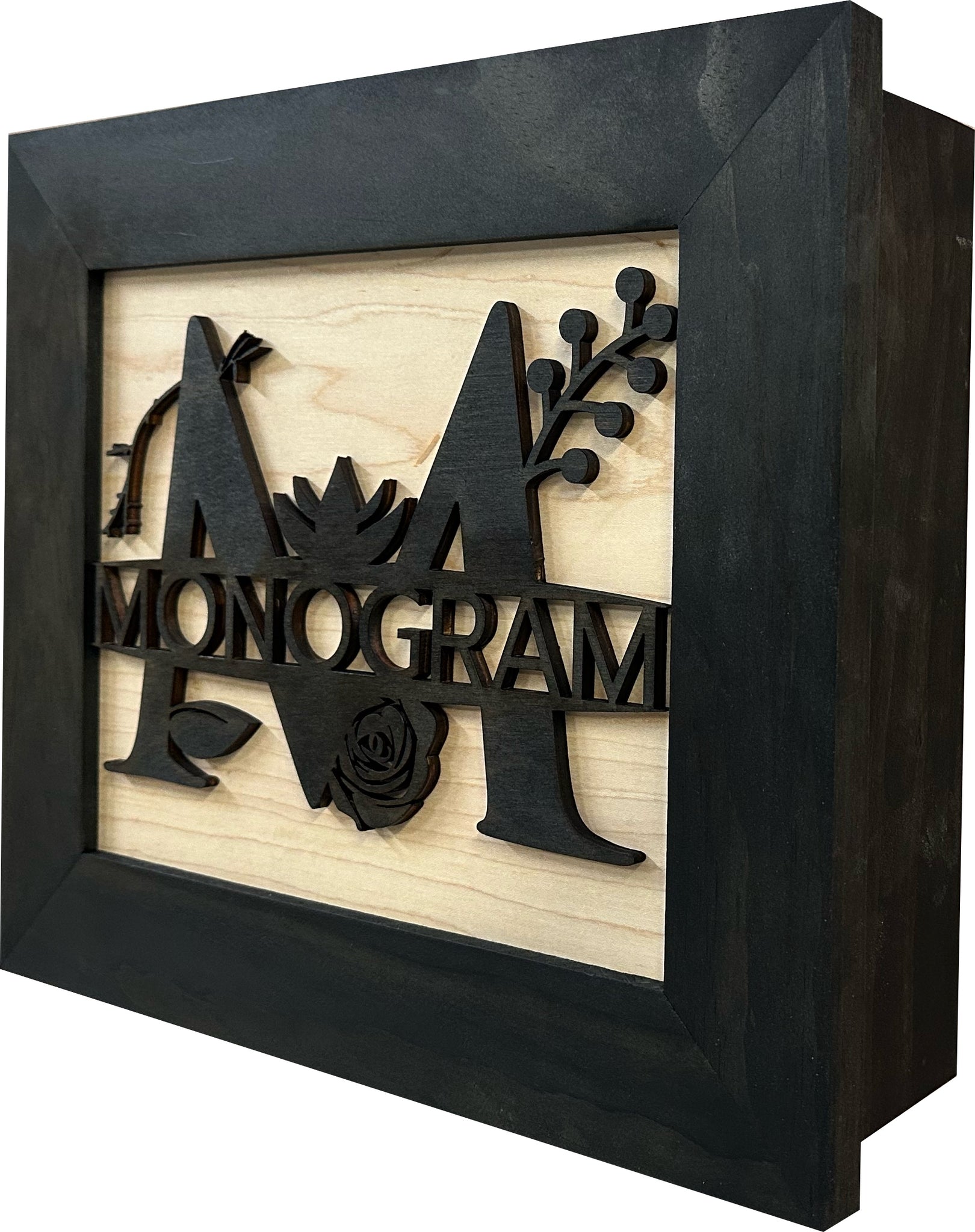 Bellewood Designs monogram hidden gun storage wall decor side angle view in black frame and natural wood finish