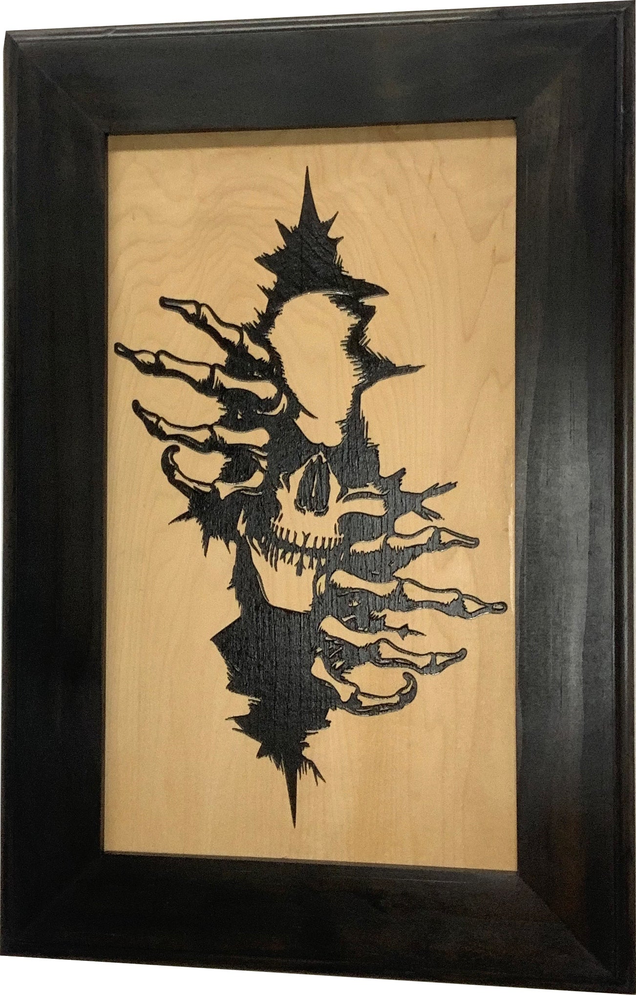 Bellewood Designs gothic skull claw hidden gun cabinet front view natural wood panel and dark frame